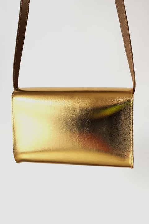 Goldene Damenledertasche im authentischen Vintage-Design
