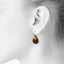 Ohrring "Aura Drop Black" mit Doppelanhängern in fluoreszierendem Orange und Schwarz