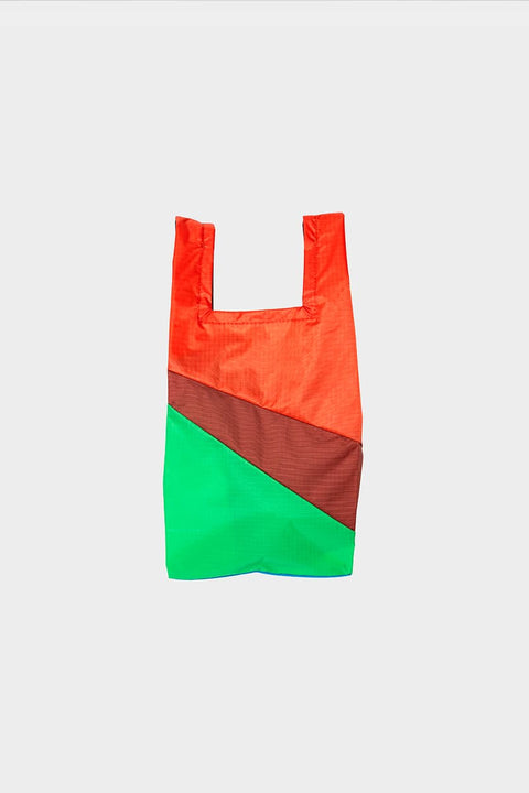 The New Shopping Bag Multi Drive Small Susan Bijl, Rückseite, diagonale Farbflächen in leuchtendem Orange, Dunkelbraun und leuchtendem Grün
