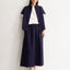 Popeline A-Linien Midi-Rock in Tinted Navy von ARMEDANGELS, Model in Frontalansicht