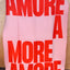 NAVUCKO Wolldecke AMORE in Rosa/Rot, drapiert im Wohnbereich