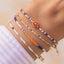 Armband mit 24k vergoldeten Metallteilen und Smiley-Perle