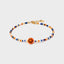 Armband mit orangefarbenem Smiley und bunten Glasperlen