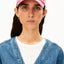 Yenaas Bold Cap in Washed Berry von ARMEDANGELS mit weißem A-Logo, Frontalansicht