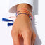 Armband Sweet String Orange Sprinkles Blush Indigo, am Handgelenk getragen, leuchtend Neon Orange, farbenfroher Hingucker