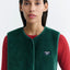 Thinking Mu Jay Vest – Detailaufnahme Druckknopfverschluss und Teddytextur