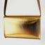 Goldene Damenledertasche im authentischen Vintage-Design