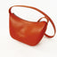 Moowalk S Handtasche von puc in leuchtendem Sunset Orange, mit verstellbarem Riemen und flachem Boden
