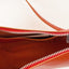Detailaufnahme der Sunset Orange Moowalk S Tasche von puc, zeigt die hochwertige Verarbeitung und Innenfächer