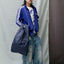 The New Shopping Bag Mono Water Large Susan Bijl in Dunkelblau, zusammengefaltet, kompaktes Format aus recyceltem Nylon