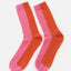 Zweifarbige Wollsocken in Pink und Orange mit vertikaler Trennlinie