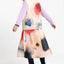 Dax Skirt Print Garden SUITE13LAB, Frontansicht A-Linie Midi-Länge mit Garden-Print, seitliche Taschen sichtbar, entspannter Fit