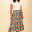 Suzi Skirt in Oranges von Pretty Vacant, weiter A-Linien-Rock wadenlang, bunter Streifen- und Zitrusfrucht-Print, Gummizug und Bindegürtel