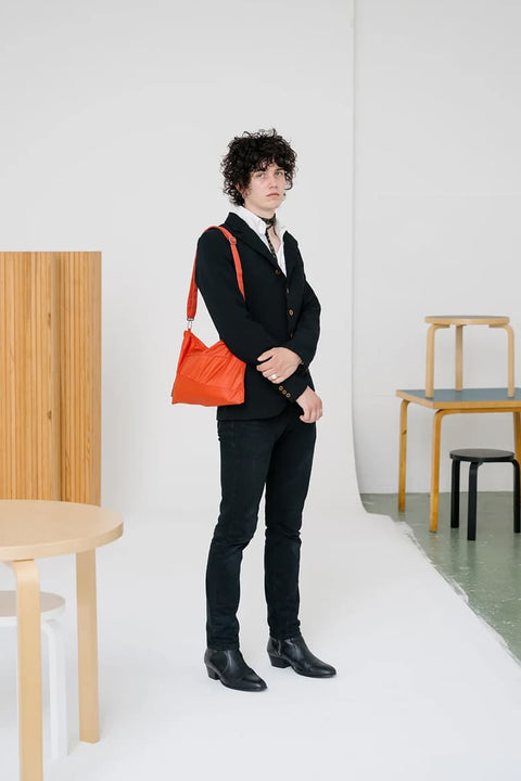 Leichte wasserdichte Tasche aus recyceltem Nylon in Orange von Susan Bijl