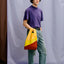 The New Shopping Bag Multi TV Yellow Medium Susan Bijl, zusammengefaltet, kompaktes Format, beide Seiten sichtbar